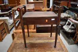 An early 20th Century mahogany framed piano stool, no seat, good upholstery project