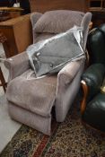 An electric recliner armchair