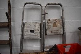 Two pairs of modern light weight metal step ladders