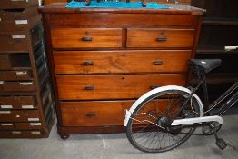 A late 19th or early 20th Century mahogany chest of two over three drawers, having phenolic handles