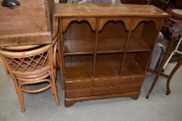 A reproduction bookshelf having dummy drawer base