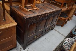 A period oak four panelled kist/coffer , carved frieze bearing date 1799, monogram MB, two drawers
