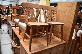 A pair of traditional solid seat kitchen chairs