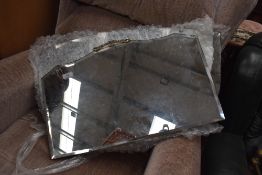 Two frameless mirrors