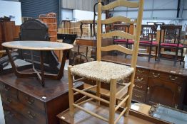 A beech framed ladder back chair having rush seat