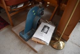 A curtain eyeleting machine, with instructions and accesories