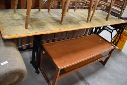 A converted oak plank top table having industrial cast iron legs