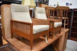 A pair of 1970s lounge chairs , frames possibly elm, canework sides
