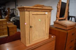A natural pine bathroom or similar wall cabinet