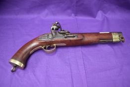 A 19th century flintlock pistol, brass mounts, swivel ram rods, lock marked Manton, lock plate