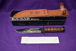 A Ka-Bar Knife, US Army Pearl Harbour 60th Anniversary, with leather scabbard, overall length