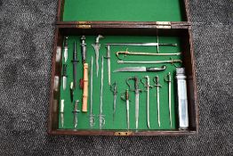 A wood case containing 23 miniature Swords and Daggers including Fairbairn Sykes Commando Dagger,