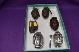 Two British Inert Hand Grenades, two British Inert Chromed Hand Grenades and two cut out sections