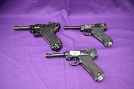 A reproduction Luger 1720 P-08 Parabfllum Pistol and two reproduction Luger Pistol with no moving
