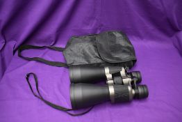 A pair of Traveler 10-30 x 60 Binoculars, all caps present, in soft carry case
