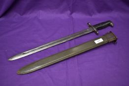 An American Bayonet for the Garand M1 Rifle Model M1 1942 with rib plastic grip, lock and release