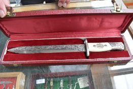 A Belgium Fabrique Nationale Presentation Bayonet being highly decorated with foliage and dragon two