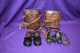A pair of early 20thC French military issue binoculars bearing serial number 289360 and with gauge