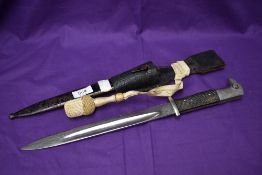 A German 1901 Period Dress Bayonet Long Patt, makers mark Weyerberg Kirschbaum & Co, leather frog