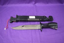 A 1985 British Knife Bayonet L3A1 for a SA80 Rifle with scabbard, scabbard contains saw blade and