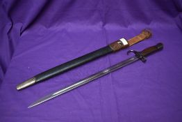 A British SMLE Bayonet Pattern 1907 with hooked quillon, marked on grip Crown T5E, blade Crown GR