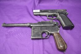 A Umarex reproduction Browning Model GPDA8 Pistol and a reproduction Waffenfabrik Mauser Pistol