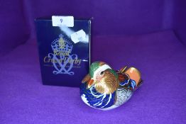 A Royal Crown Derby mandarin duck having silver stopper,with box.