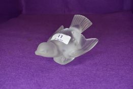 A glass bird in the Lalique bearing indistinct signature.
