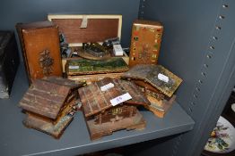 A collection of vintage trinket and jewellery boxes,some musical,others in the form of cottages also