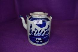 A Chinese export hard paste tea pot with blue and white decoration