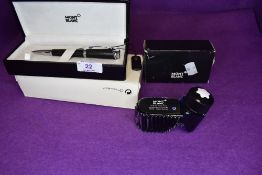 A Montblanc ballpoint pen in original case. Black with diamond pattern to the band and Amethyst in