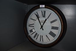 A vintage station style wall clock.