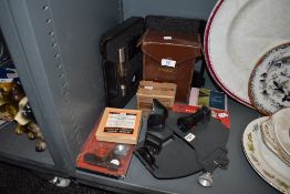 A selection of photographic equipment and similar accessories