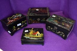 Four vintage music boxes with inlaid,hand painted details and carved details.