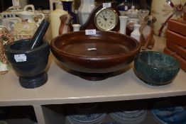 A stone cut mortar and pestle and similar bowls one wood one agate