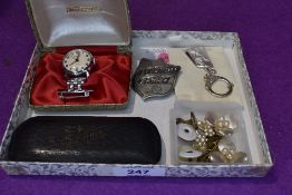 A small selection of jewellery including Ingersoll Nursing watch, vintage glasses with yellow