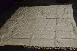 An early 1920s Chinese bed throw having tassels to edge.
