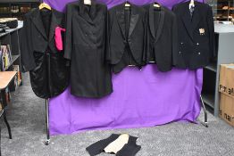A collection of gents vintage and antique suits, tail coats and jackets.