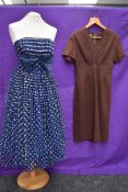 Two 1950s vintage dresses,one strapless dress having flocked white dots to tulle overlay,full