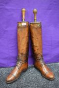 A pair of antique tan leather boots with boots trees,made my Bartley and Sons,London(1885-1920)Owned