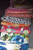 A selection of vintage fabrics, good quantities of each and in various colours, predominantly 60s