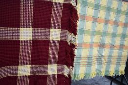 A lovely bright vintage waffle blanket in red and yellow and another blanket having check pattern.