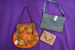 Two vintage evening bags, one having colourful embroidery with clasp frame,and the other in a blue