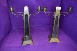 A pair of antique brass candle stick holder with glass inserts to front(currently loose and will