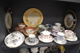 A mixed lot of vintage ceramics including highly decorated cups and saucers, plates and more.