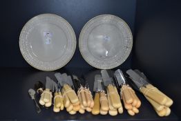 A selection of vintage flat ware and two Belleek plates.