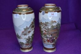 A pair of highly decorated Japanese satsuma vases.