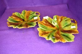 A pair of majolica style leaf dishes.