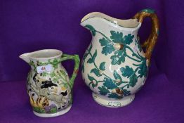 Two vintage Masons jugs, one having scene of animals attacking each other, the other having oak leaf