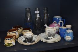 A collection of vintage Souvenir items from Sedbergh and Hawes, and three milk bottles.